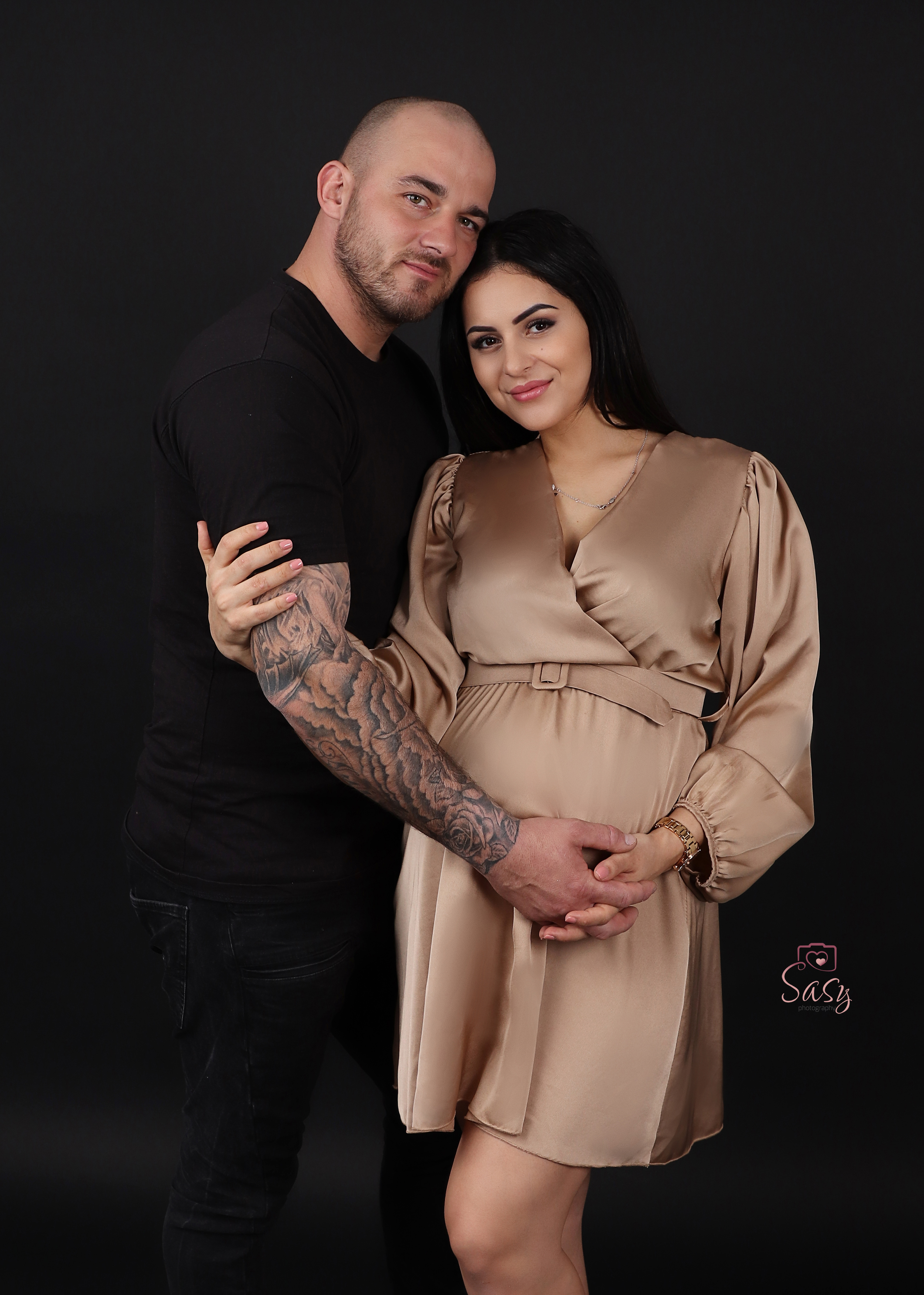 Proud couple, the family grows - at Sasy Photography
